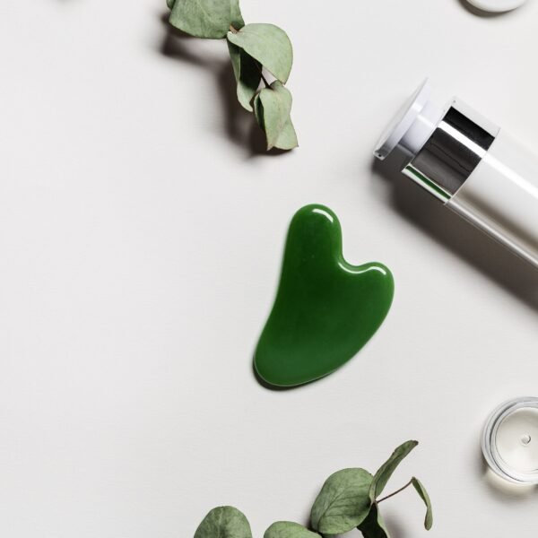 Gua Sha, cream bottle, leaves